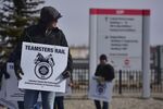 Workers demonstrate picket during a Canadian Pacific Railway strike in Calgary on March 20, 2022.
