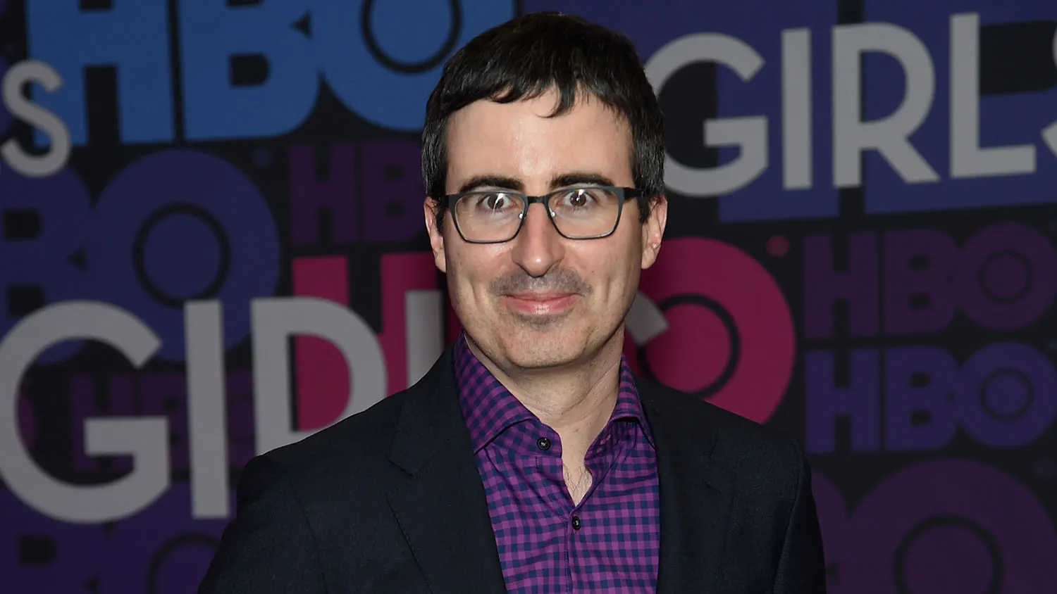 John Oliver attends the 'Girls' season four series premiere at American Museum of Natural History on January 5, 2015 in New York City.
