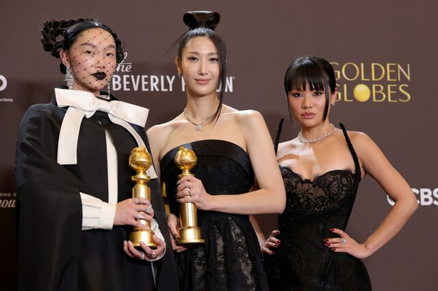 Vocal trio Audrey Nuna, Ejae and Rei Ami hold their Golden Globe after winning best original motion picture song for “Golden.” Ejai (center), the singing voice of character Rumi, co-wrote the song.