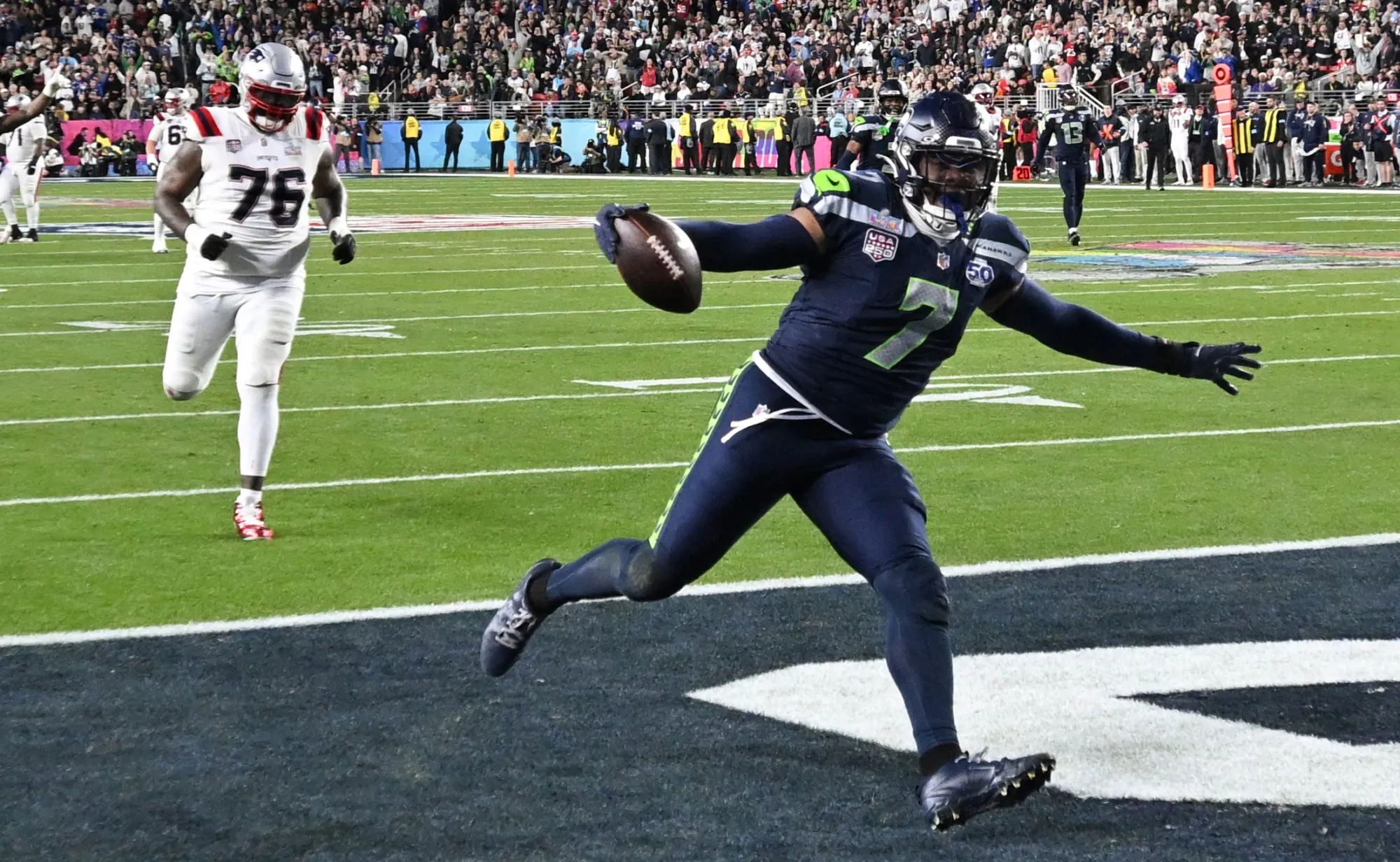 Seattle Seahawks' linebacker Uchenna Nwosu scores a touchdown during Super Bowl LX on Feb. 8.