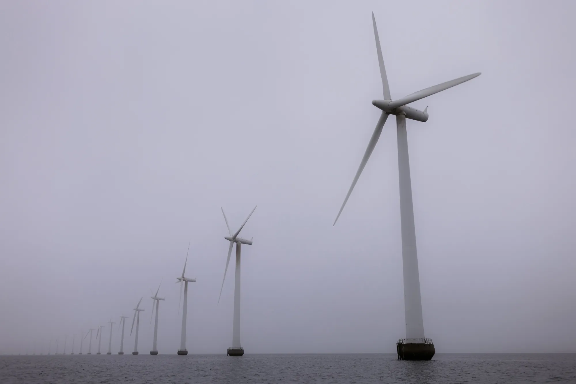 Offshore wind turbines at the Middelgrunden wind farm off the coast of Copenhagen, Denmark.