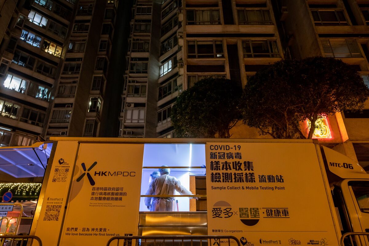 Hong Kong threatens to knock down doors to force Covid tests