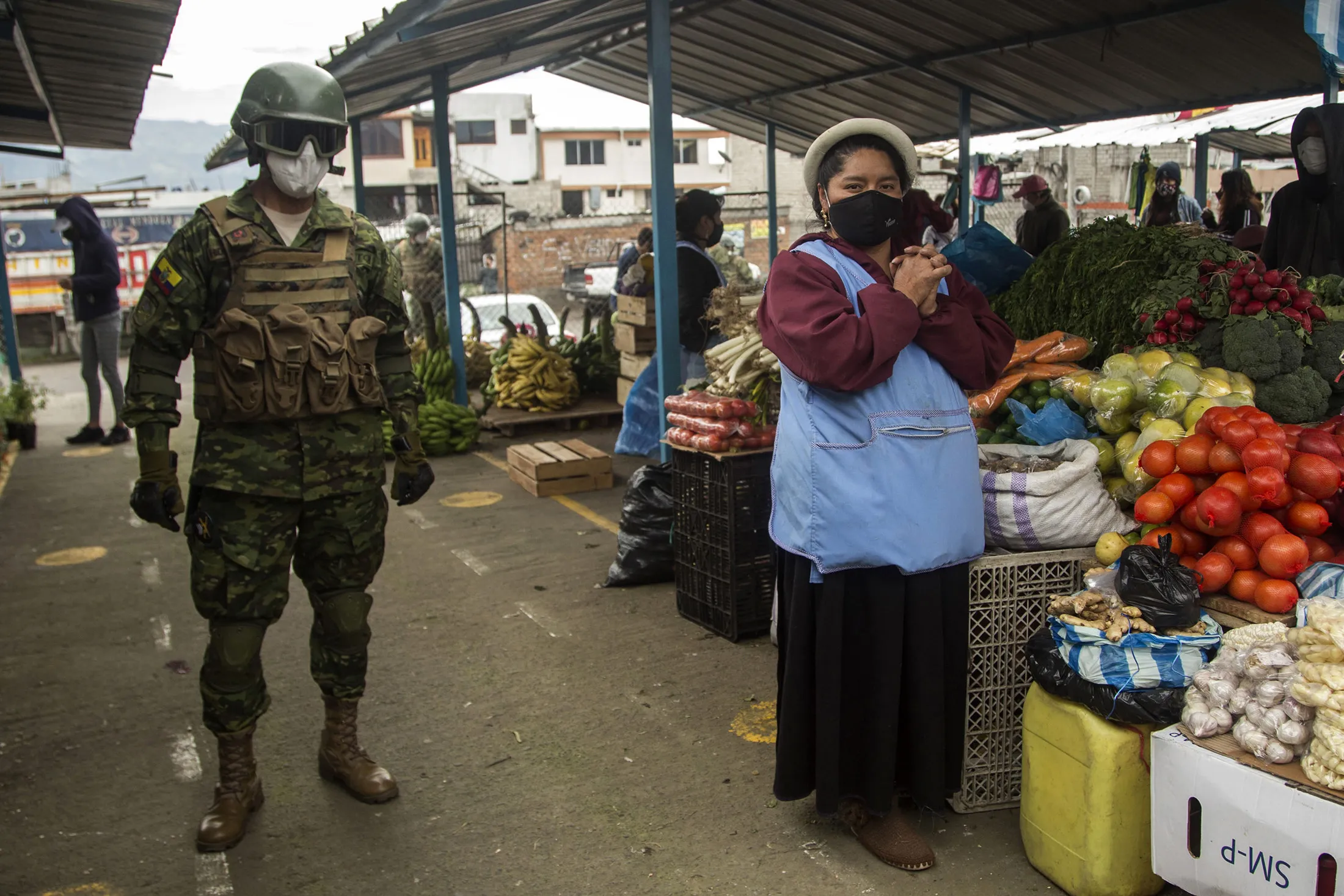 An Ecuadorean soldier patrols a market&nbsp;in southern Quito, on July 17, 2020.