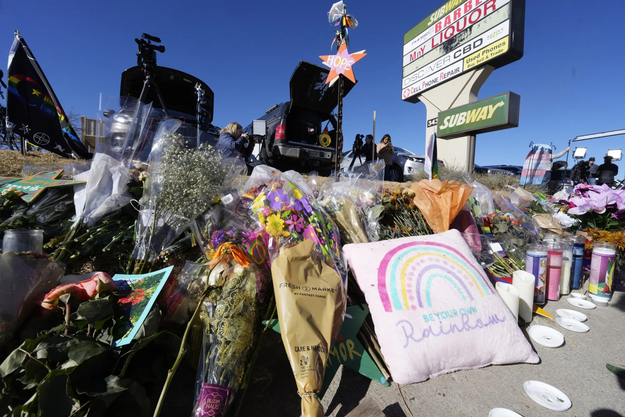 Bouquets of flowers sit on a corner near Club Q in Colorado Springs, Colorado.