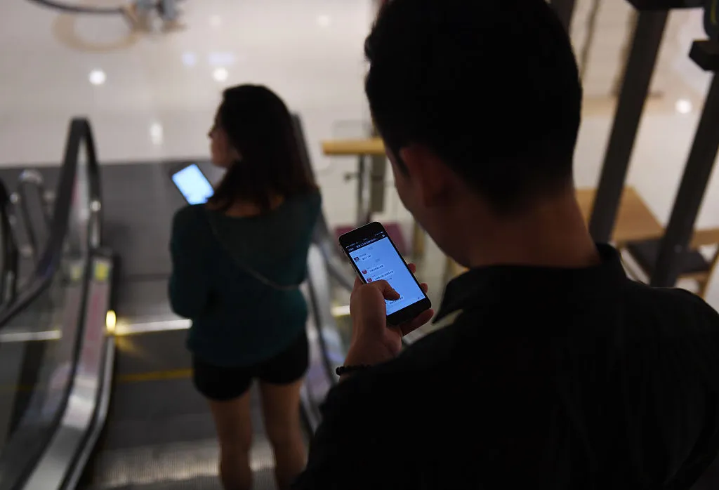 At the mall, but on the phone.
