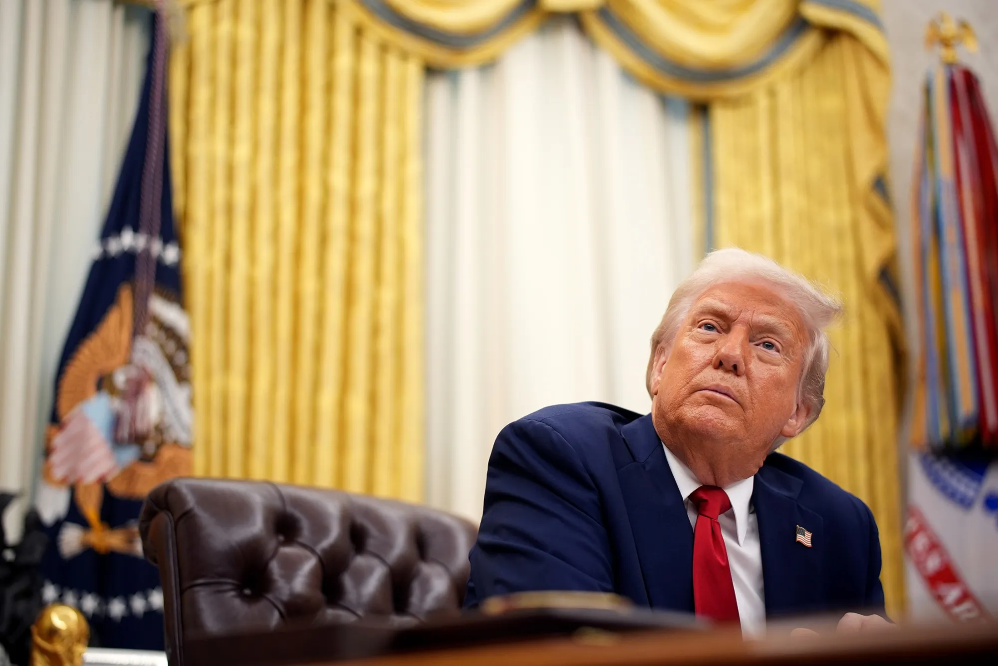Donald Trump speaks in the Oval Office of the White House in Washington on March 31.