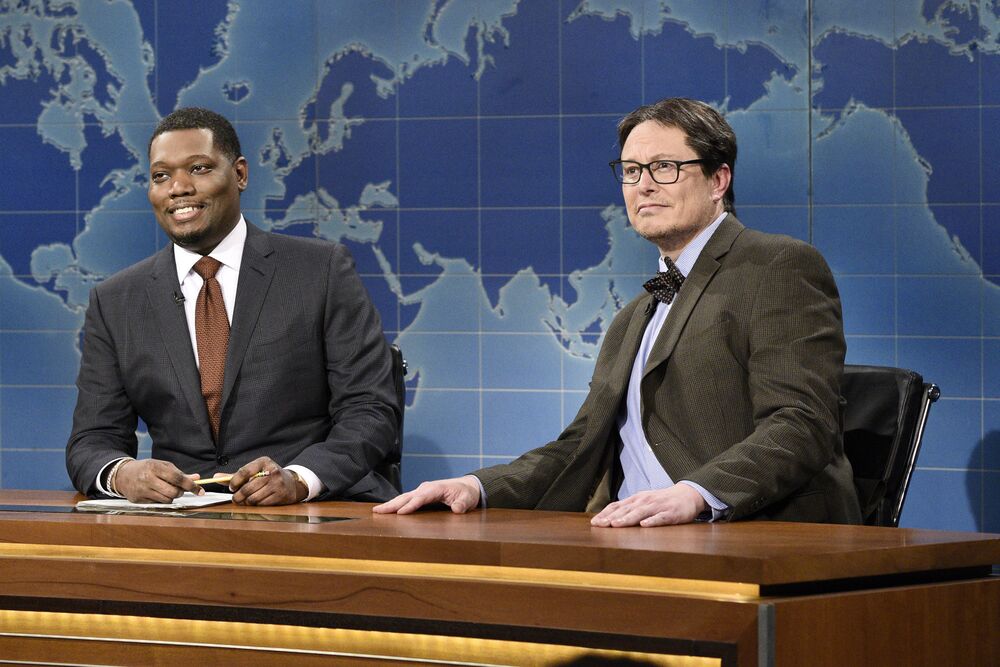 Colin Jost and host Elon Musk as Financial Expert Lloyd Ostertag during "Weekend Update" on May 8.