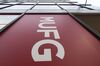 Signage is displayed at a MUFG Bank Ltd. Next store in Tokyo, Japan, on Tuesday, Jan. 16, 2019. Lenders have begun allowing customers to transfer money or make payments with their smartphone or a tablet, instead of hanko, a personal stamp used to sign documents.