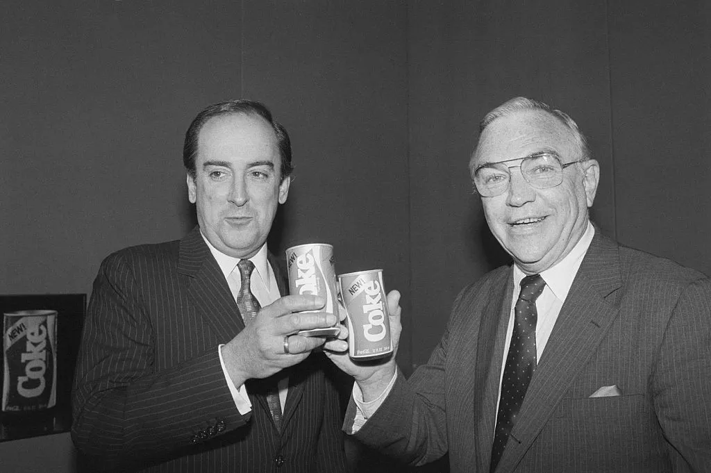 Coca-Cola CEO Roberto Goizueta, left; New Coke, center; and President Don Keough, right.
