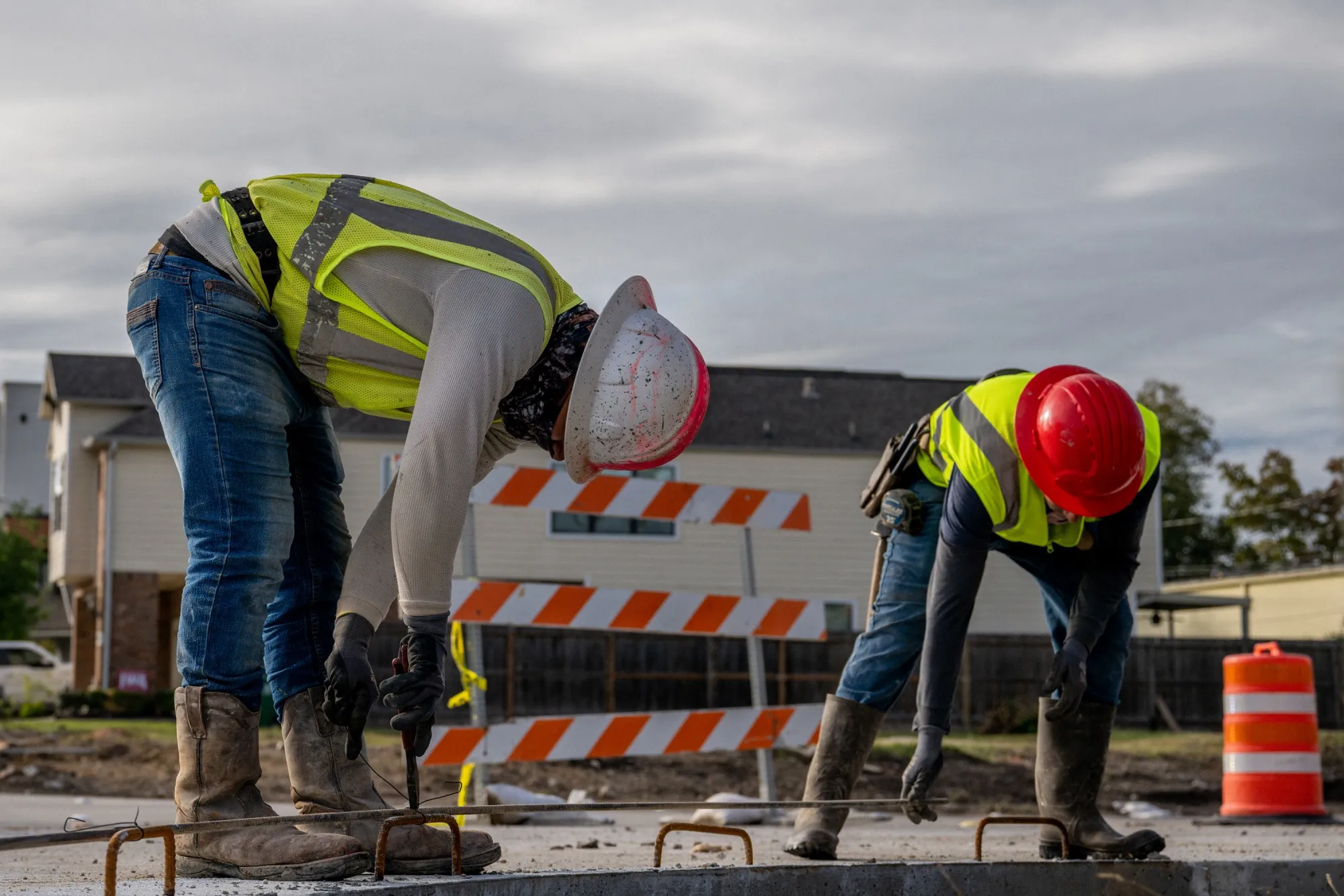 Construction workers work on repairing an intersection&nbsp;in Houston.