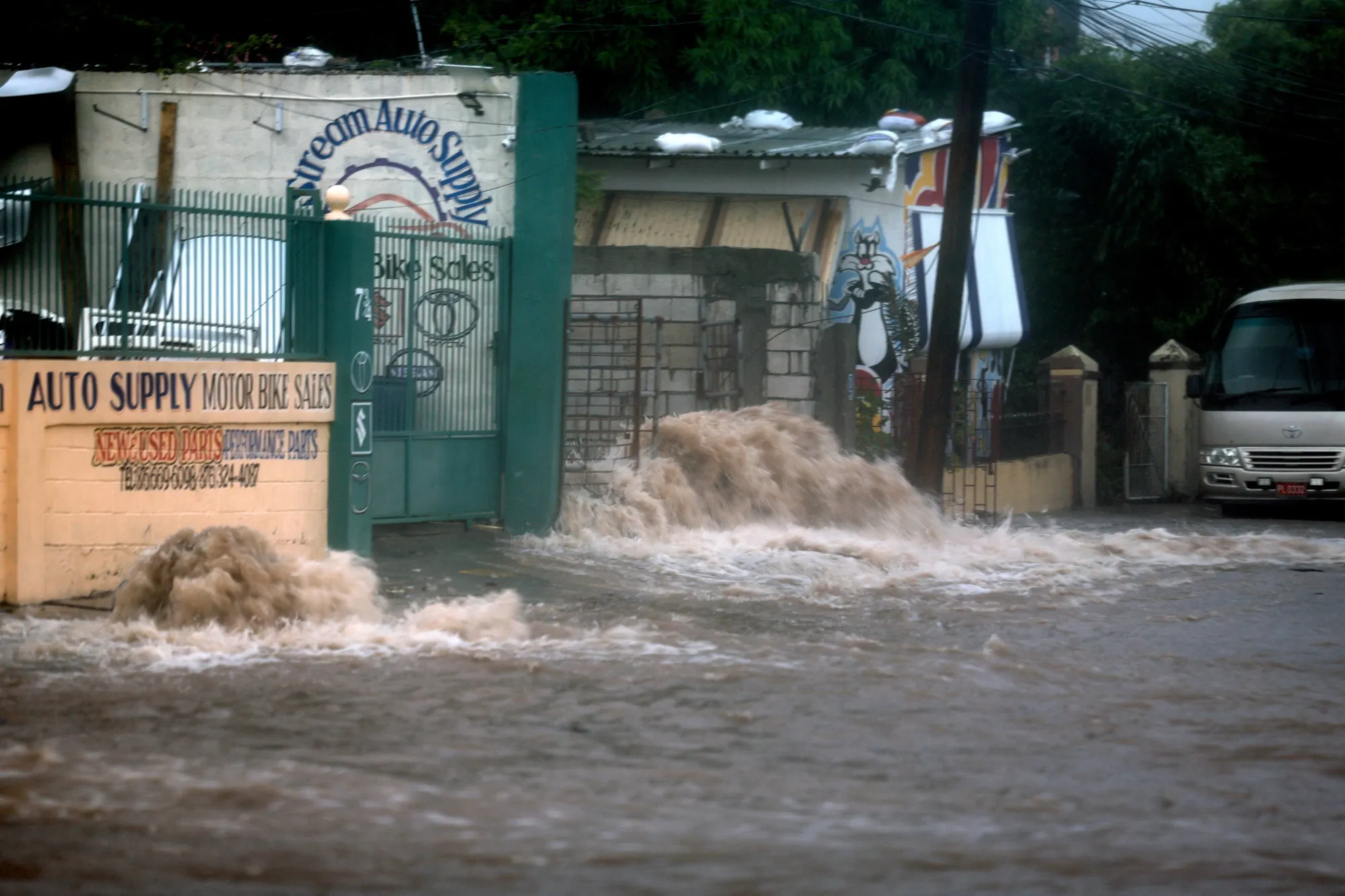 Flood waters pour onto the street in Kingston, Jamaica.