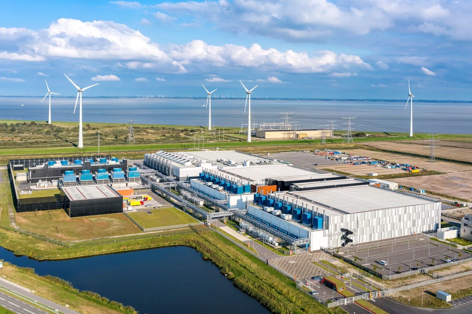 Wind turbines spin near Google’s&nbsp;data center in&nbsp;Eemshaven, Netherlands.