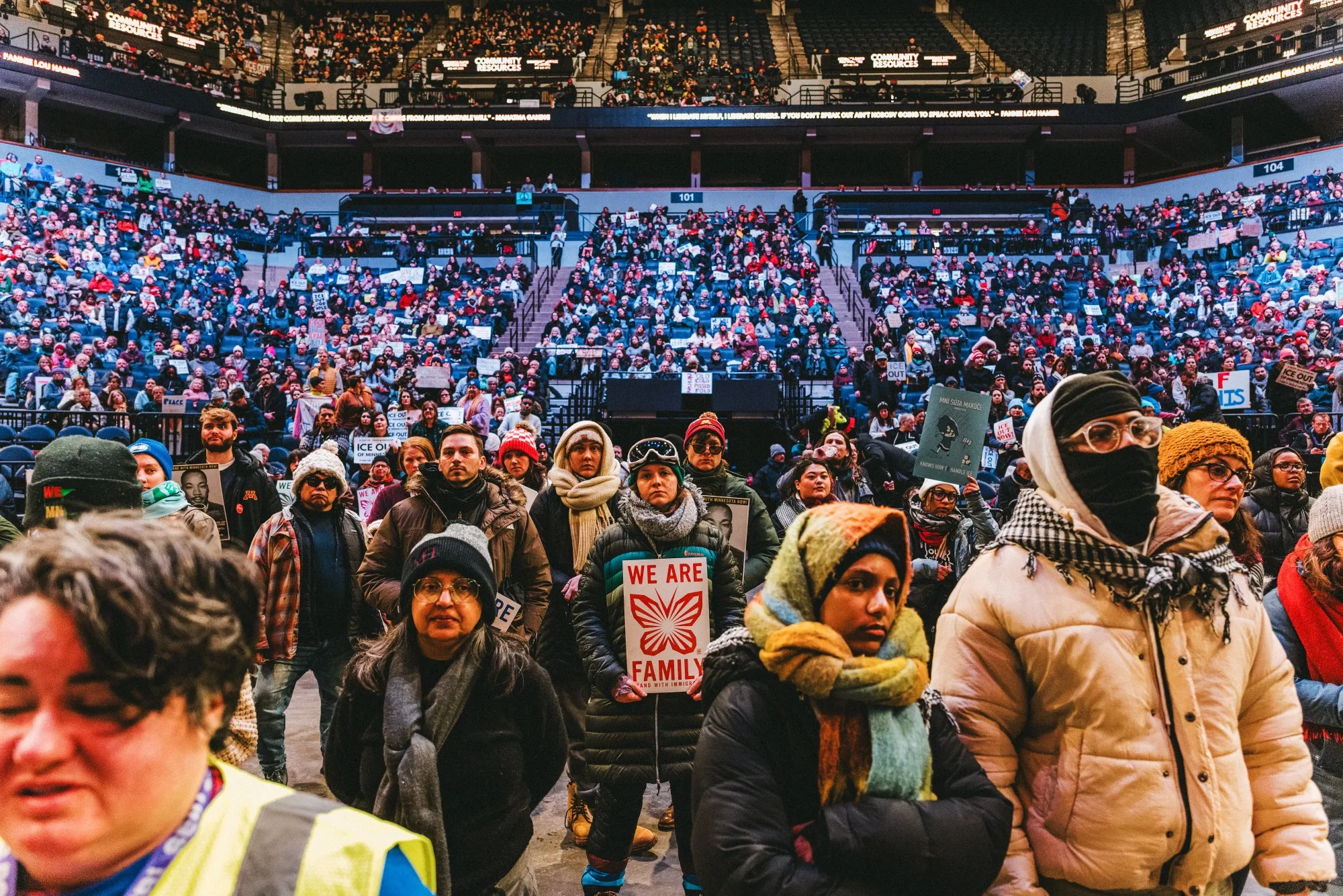 Demonstrators against the ongoing Immigration and Customs Enforcement deployment hold signs during a rally at the Target Center in Minneapolis on Jan. 23.