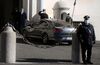 The car carrying Italian Prime Minister Giuseppe Conte arrives at the Presidential palace in Rome on Jan. 26.
