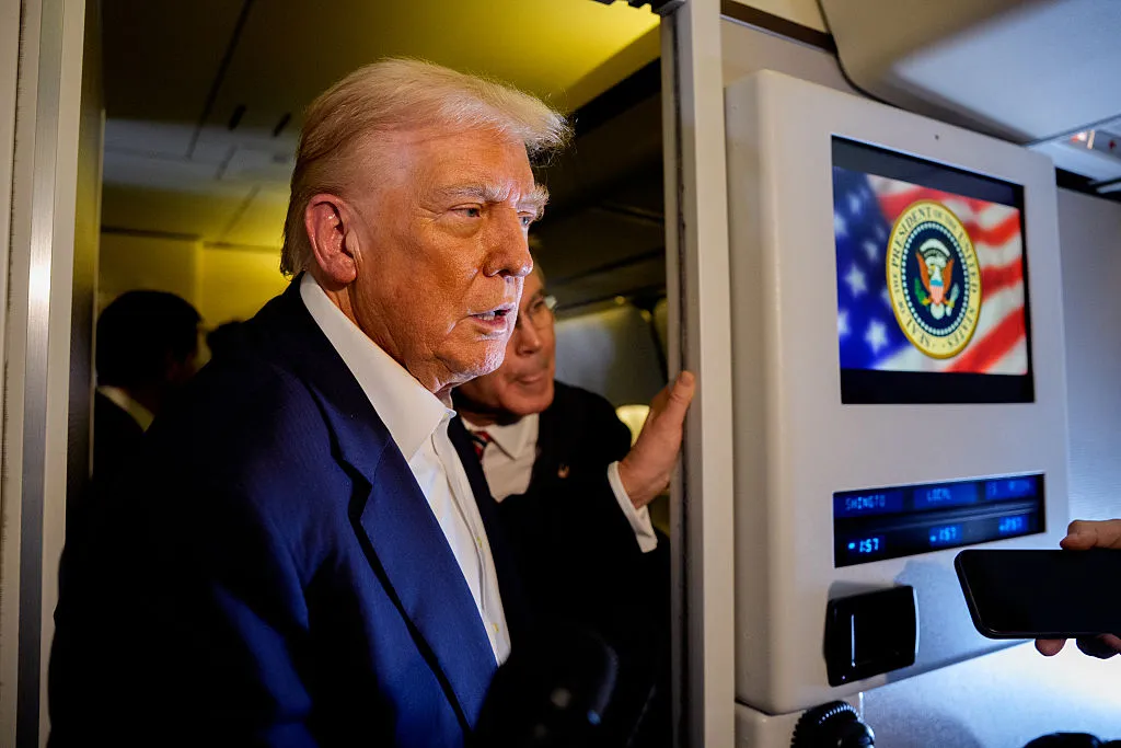 Donald Trump speaks to members of the media aboard Air Force One&nbsp;on Oct.&nbsp;27.