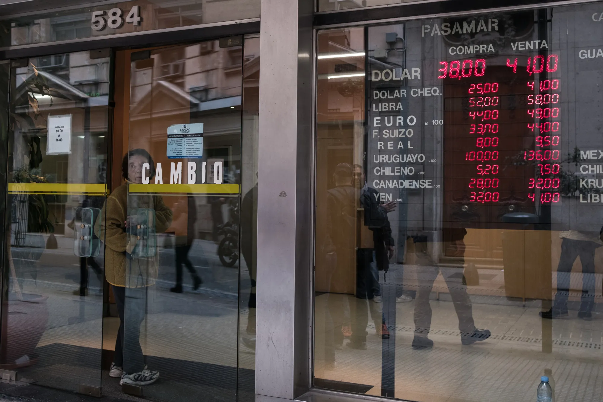 A sign displaying exchange rates is displayed inside a currency exchange house in Buenos Aires&nbsp;on&nbsp;Aug. 30.&nbsp;
