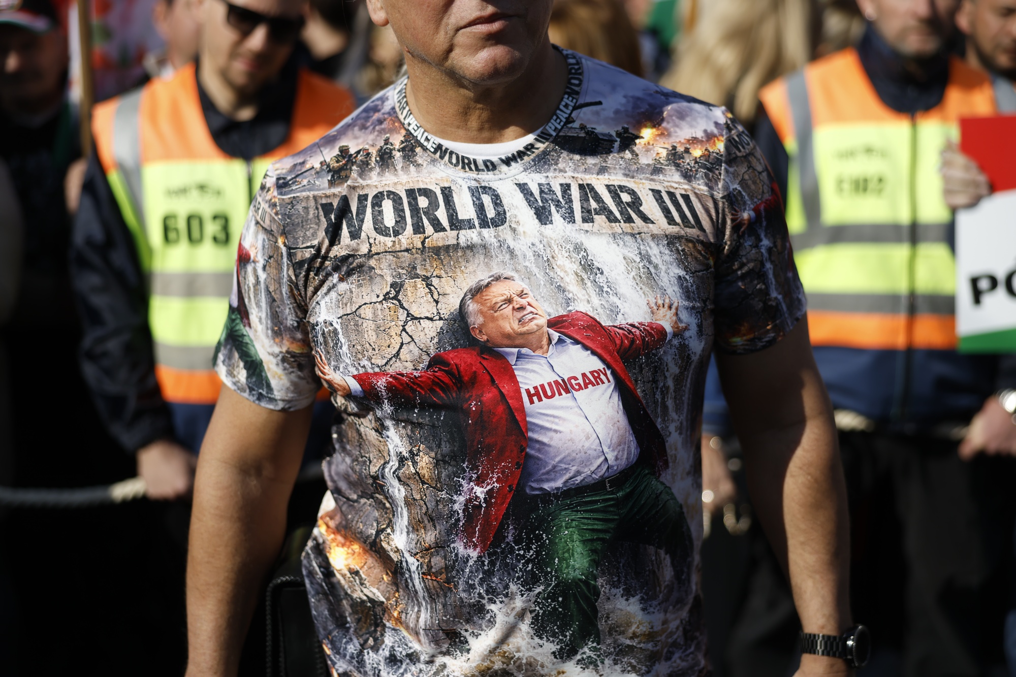 A demonstrator wearing a printed shirt in support of Hungary's prime minister Viktor Orban and the government, ahead of a general election in Budapest, Hungary, on Sunday, March 15, 2026. Supporters of Orban and his rival were gathering in Budapest on Sunday for a final big test of strength before next month's election, which polls suggest could bring an end to the Hungarian prime minister's 16-year rule. Photographer: Akos Stiller/Bloomberg