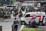 Gojek riders wait for customers in Jakarta.