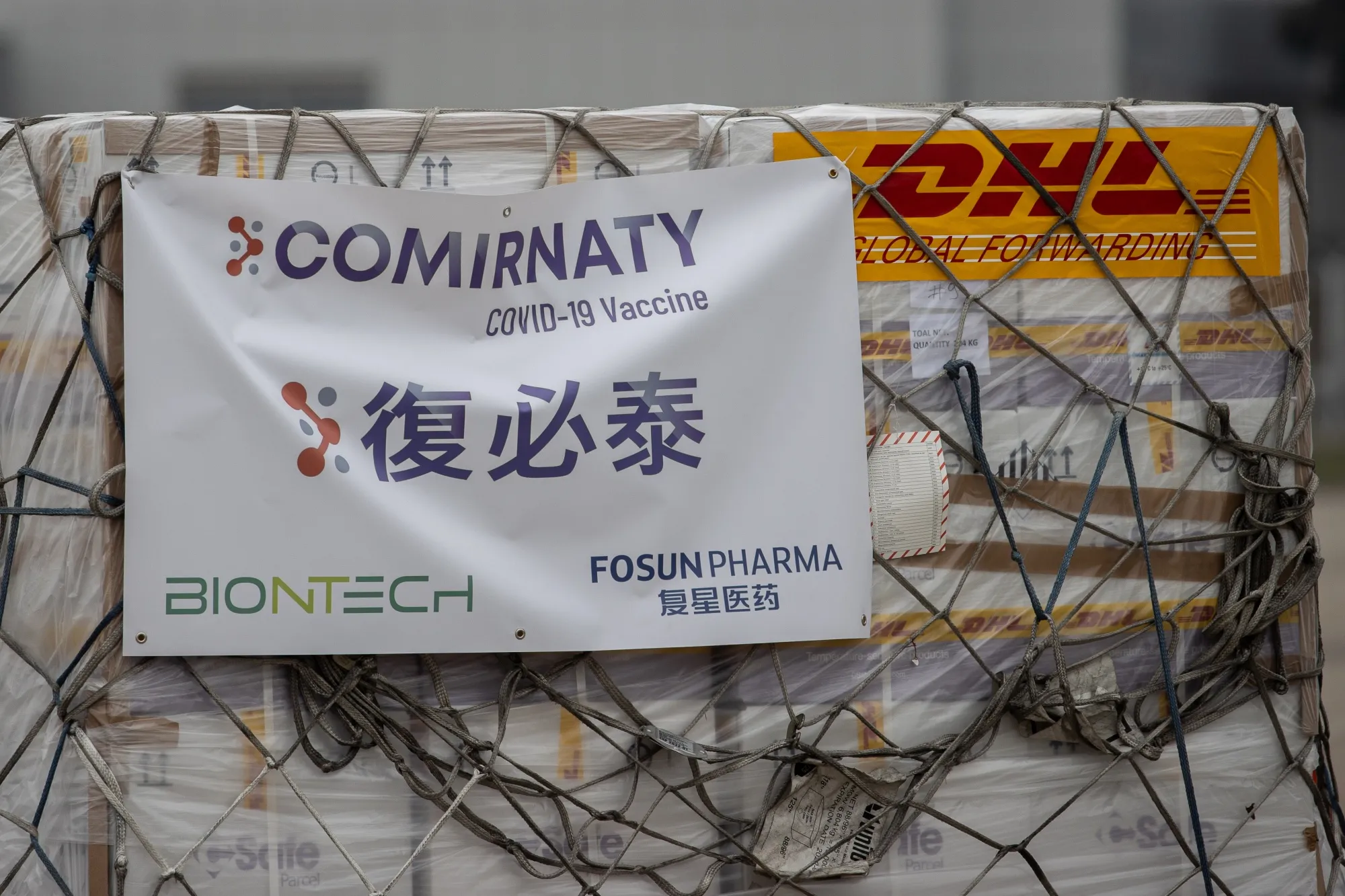 Refrigerated shipping containers carrying the BioNTech Covid-19 vaccine imported by Fosun Pharma&nbsp; at the Hong Kong International Airport on Feb. 27.