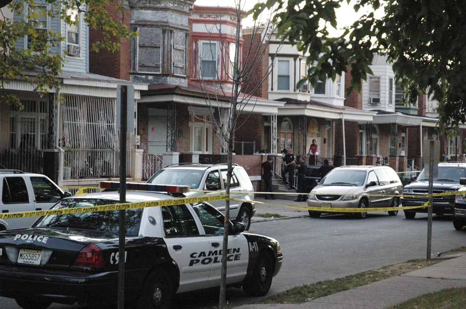 Camden police respond to a fatal shooting in 2008. 10 years later, the police force is transformed and murders like these are in decline.