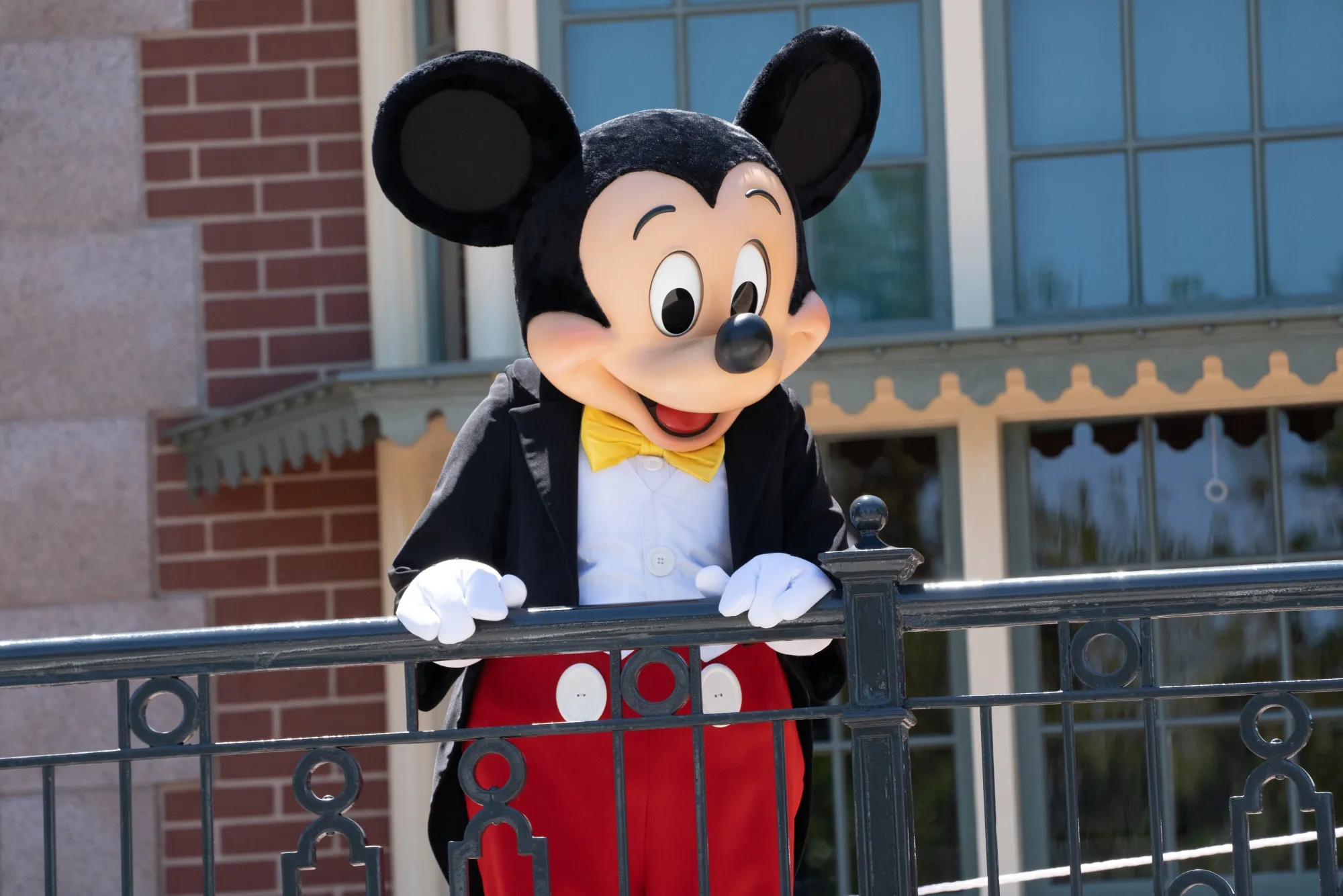 A performer dressed as Mickey Mouse entertains guests at Disneyland theme park in Anaheim, California.