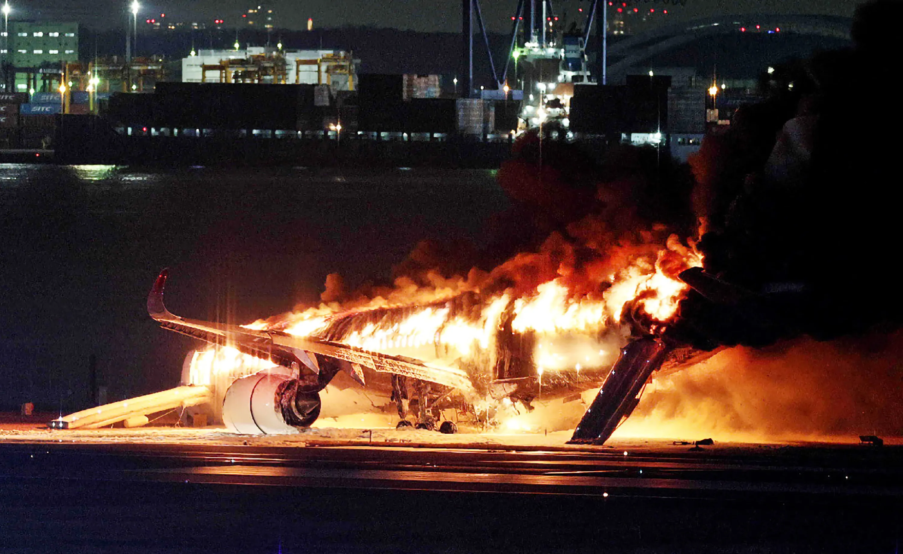A Japan Airlines plane on fire on a runway of Tokyo’s Haneda Airport on Jan. 2.