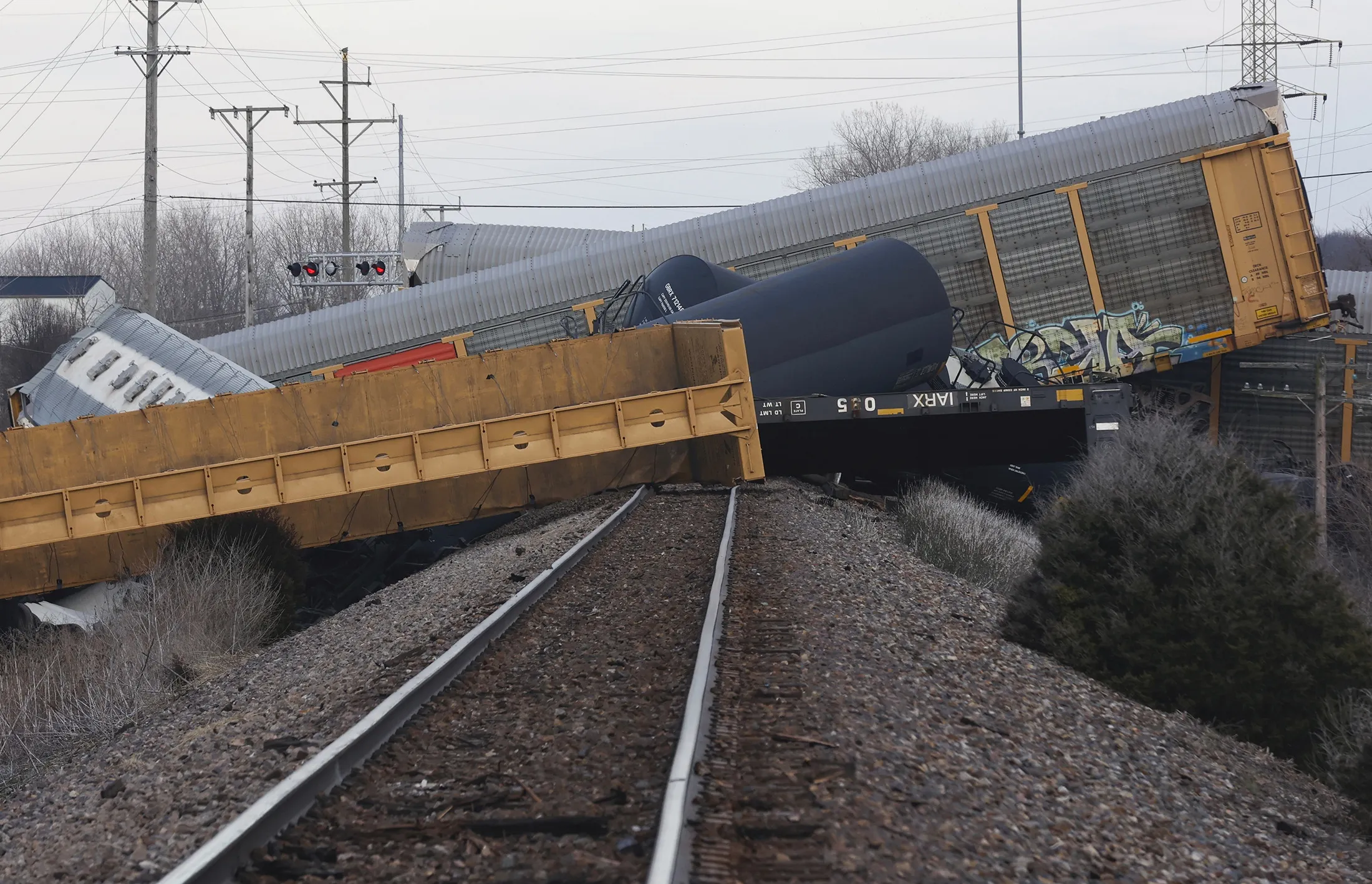 Multiple cars of a Norfolk Southern train lie toppled after derailing at a train crossing with Ohio 41 in Clark County, Ohio, on&nbsp;March 4.