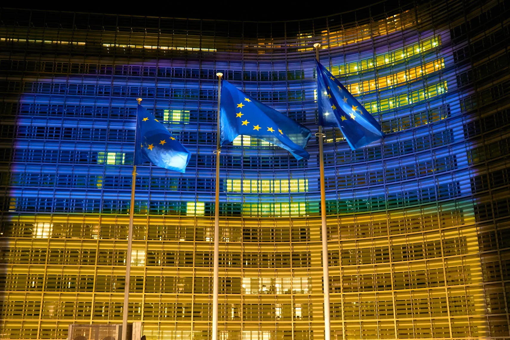The European Commission's Berlaymont building lit up in the colors of the Ukrainian flag.