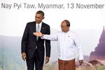 U.S. President Barack Obama is greeted by Myanmar President Thein Sein on the second day of the ASEAN summit on Nov. 13
