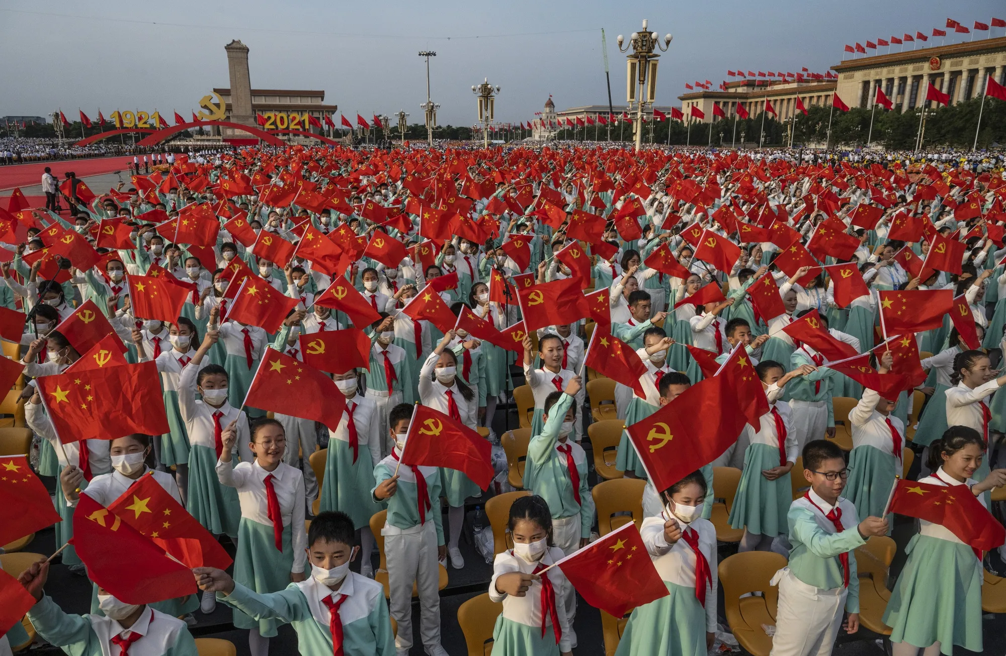 Chinese students wave party and national flags&nbsp;in Beijing.