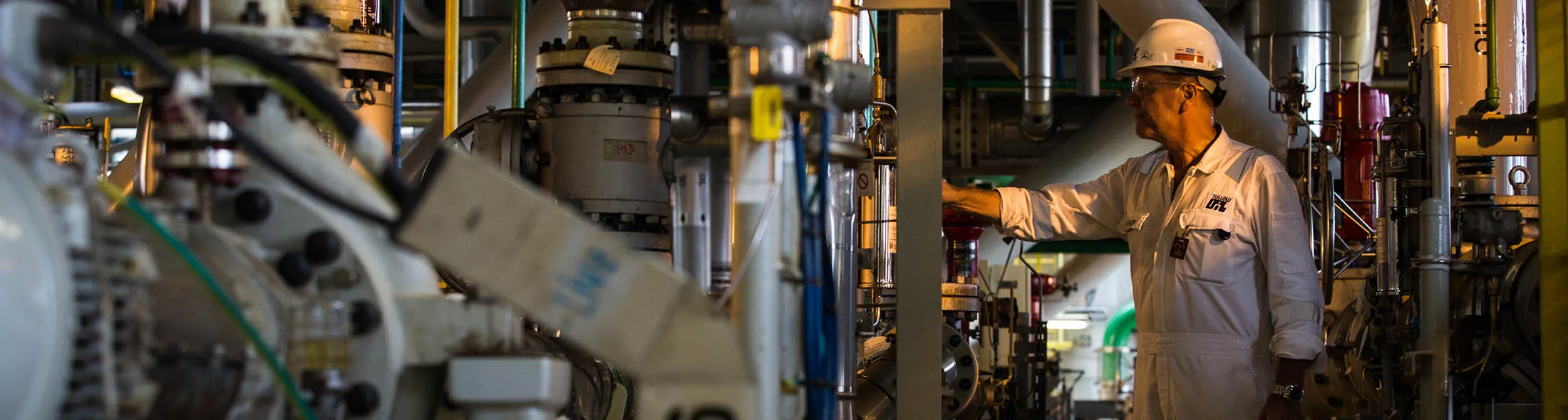 A worker checks a dial on the Tullow Oil Plc Prof. John Evans Atta Mills Floating Production Storage and Offloading (FPSO) vessel docked at the Sembcorp Marine Tuas shipyard in Singapore, on Thursday, Jan. 21, 2016. The FPSO will receive, process and store crude oil at Tullow's Ten Project oil development around 60 kilometers offshore Western Ghana. The explorer and producer expects its net debt to keep on rising until the Ten Project goes into production in the middle of this year before declining from that point onwards, according to Chief Executive Officer Aidan Heavey.

