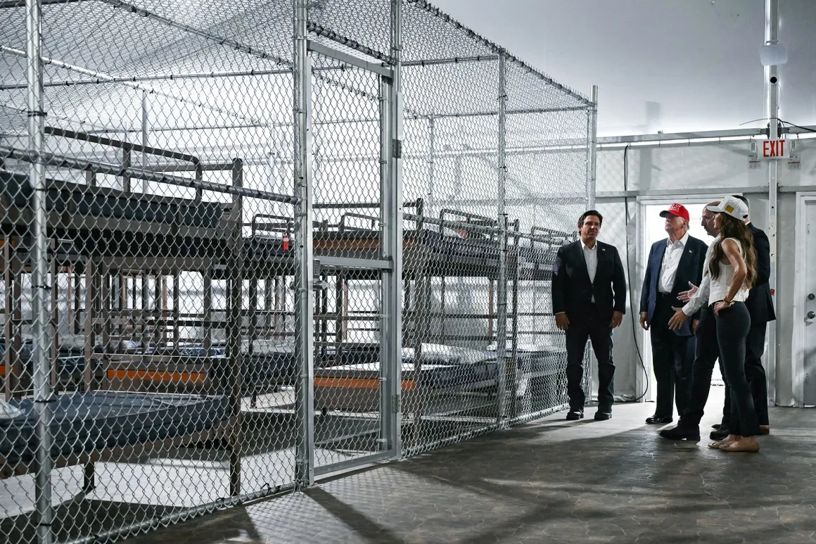 President Donald Trump, center, Florida Governor Ron DeSantis, left, and Secretary of Homeland Security Kristi Noem tour a migrant detention center, dubbed "Alligator Alcatraz,” in Ochopee, Florida, on July 1.