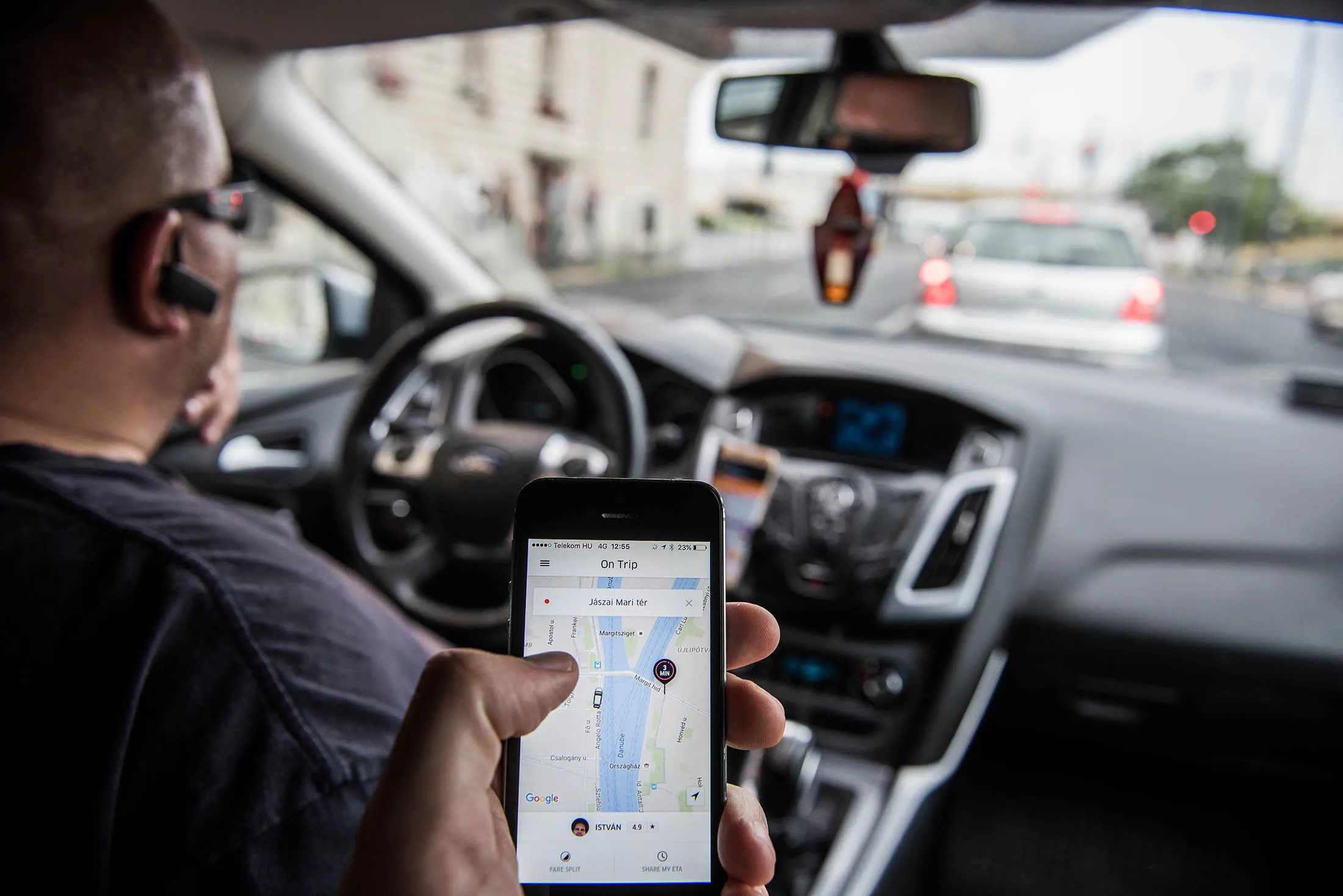 A passenger monitors the journey progress through the Uber app in Hungary.
