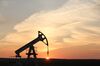 An oil pumping unit, also known as a "nodding donkey" or pumping jack, operates at sunset at a drilling site operated by Tatneft OAO near Almetyevsk, Russia, on Friday, July 31, 2015.