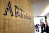 An employee walks through the Artradis Fund Management office in Singapore, Friday, June 30, 2006.