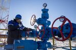 A worker turns a valve wheel at the Chayandinskoye oil, gas and condensate field, Russia.
