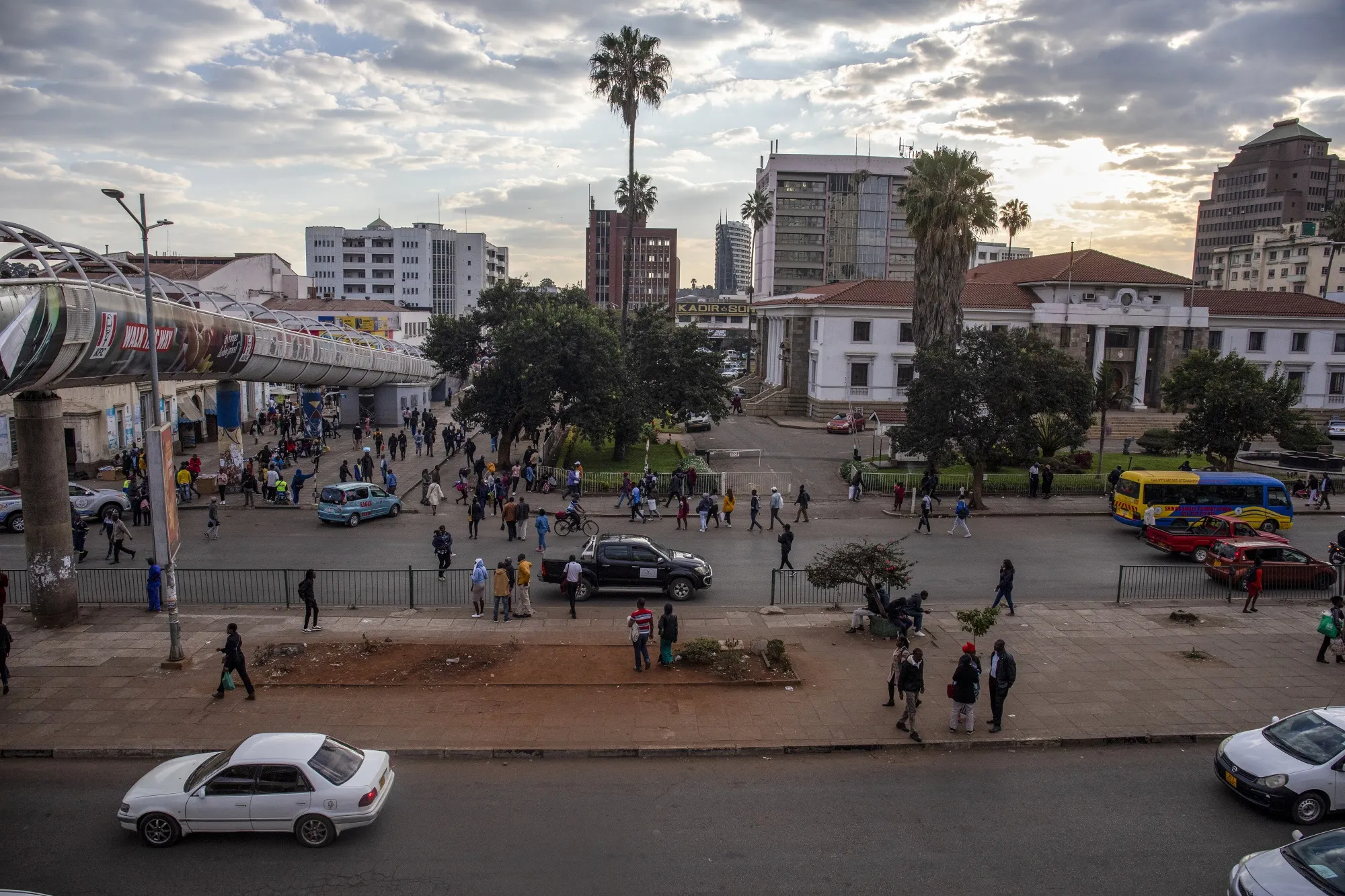 Pedestrians and a highway in the central business district of Harare, Zimbabwe.