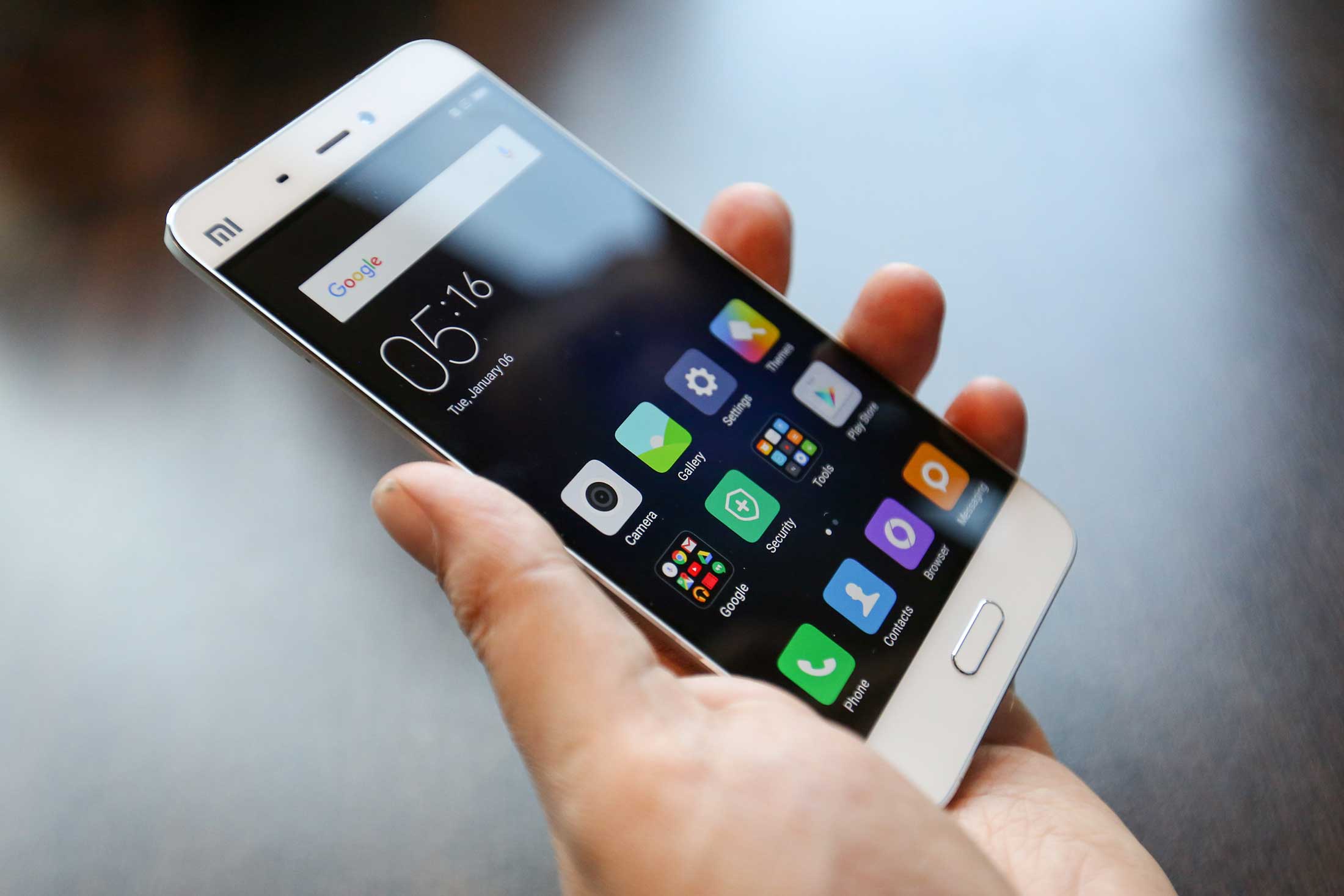 An attendee handles the Mi5 smartphone, manufactured by Xiaomi Corp.
