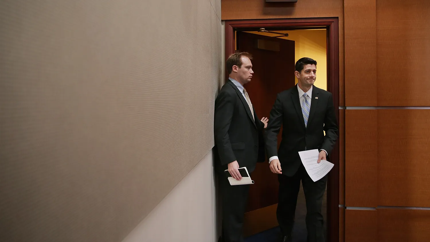 Speaker of the House Paul Ryan (right) arrives for his weekly news conference at the U.S. Capitol on Jan. 7, 2016, in Washington.
