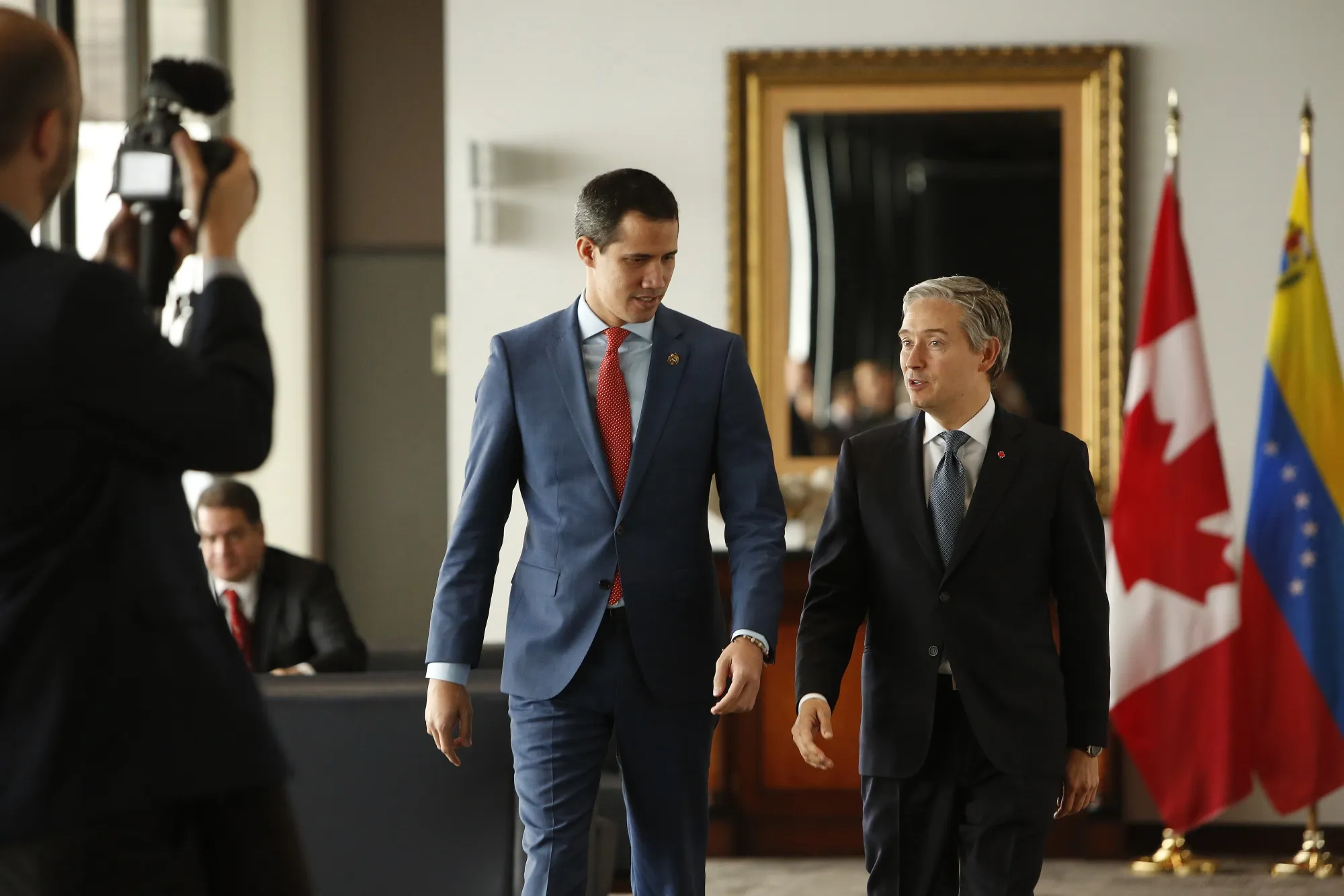 Juan Guaido and Francois-Philippe Champagne arrive at a press conference in Ottawa on Jan. 27, 2020.