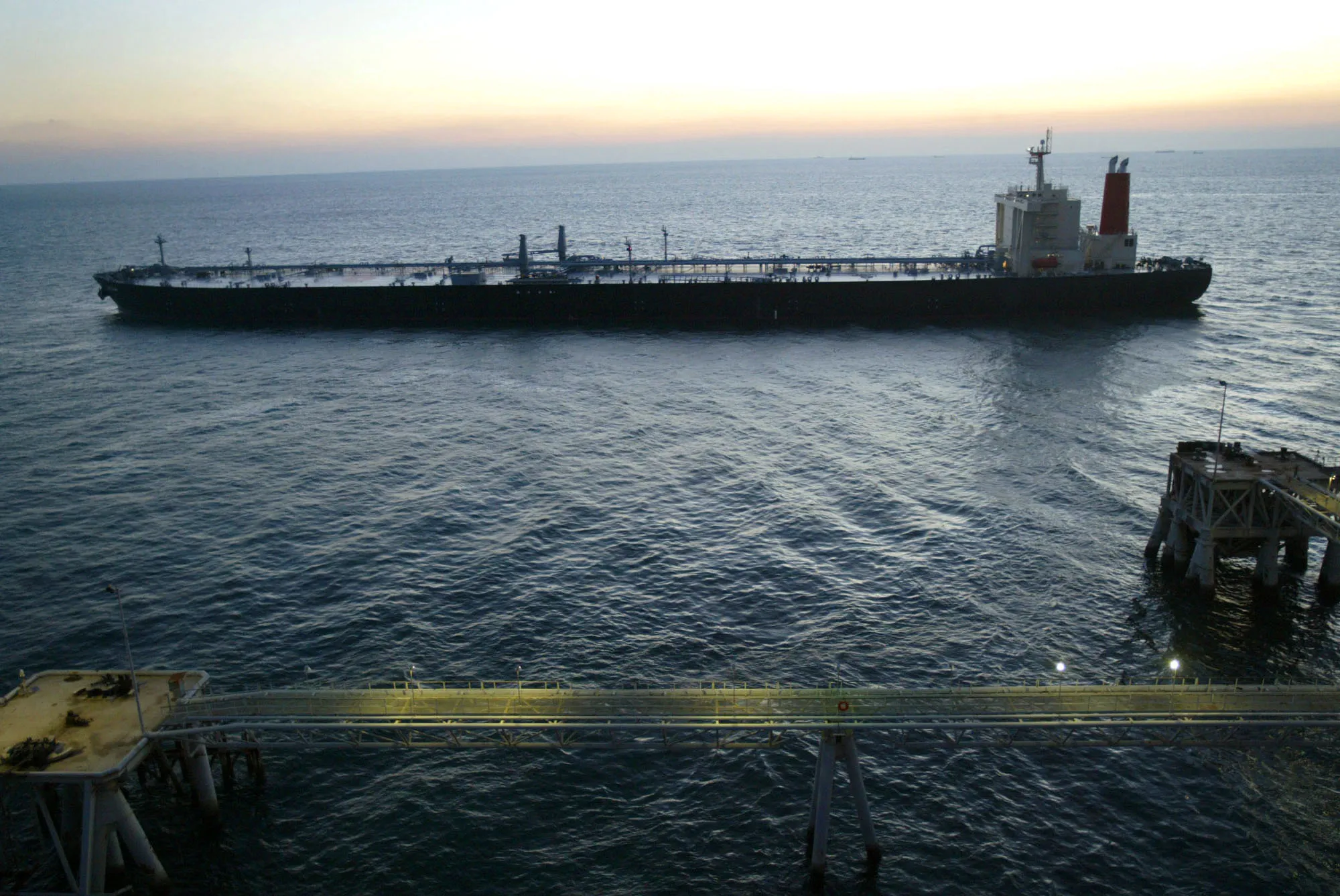 A tanker leaves the Basra Oil Terminal in the Gulf 50kms south of Iraq Sunday December 7, 2003.
