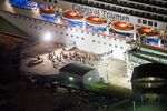 The media await the final unloading from the crippled cruise liner Carnival Triumph Feb. 14, 2013 in Mobile, Alabama&#13;
