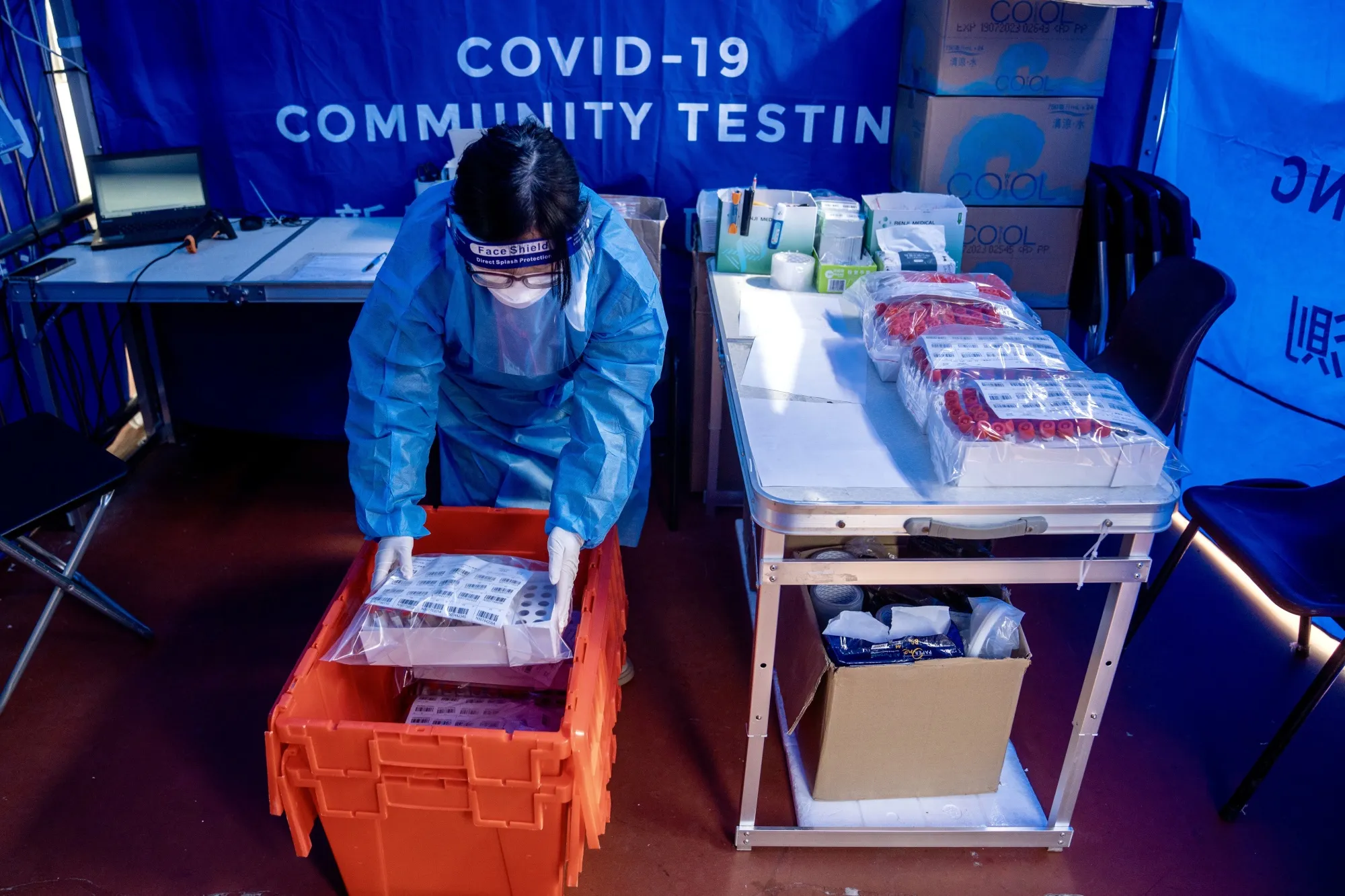 A healthcare worker&nbsp;prepares samples to be delivered to a laboratory at a Covid-19 testing facility on Feb. 25.