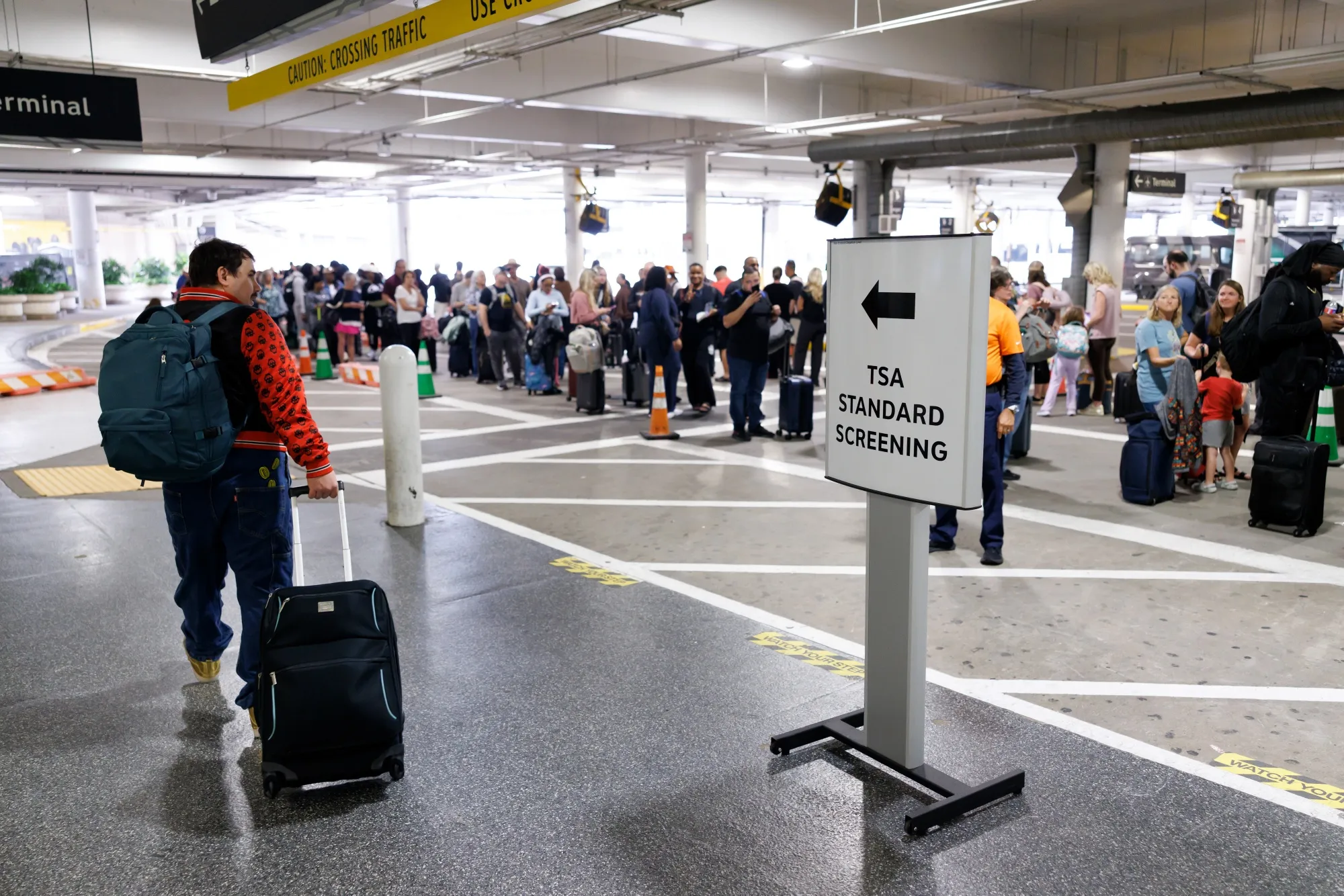 Travelers wait in line at a Transportation Security Administration (TSA) checkpoint at William P. Hobby Airport in Houston, Texas, on&nbsp;March 9.