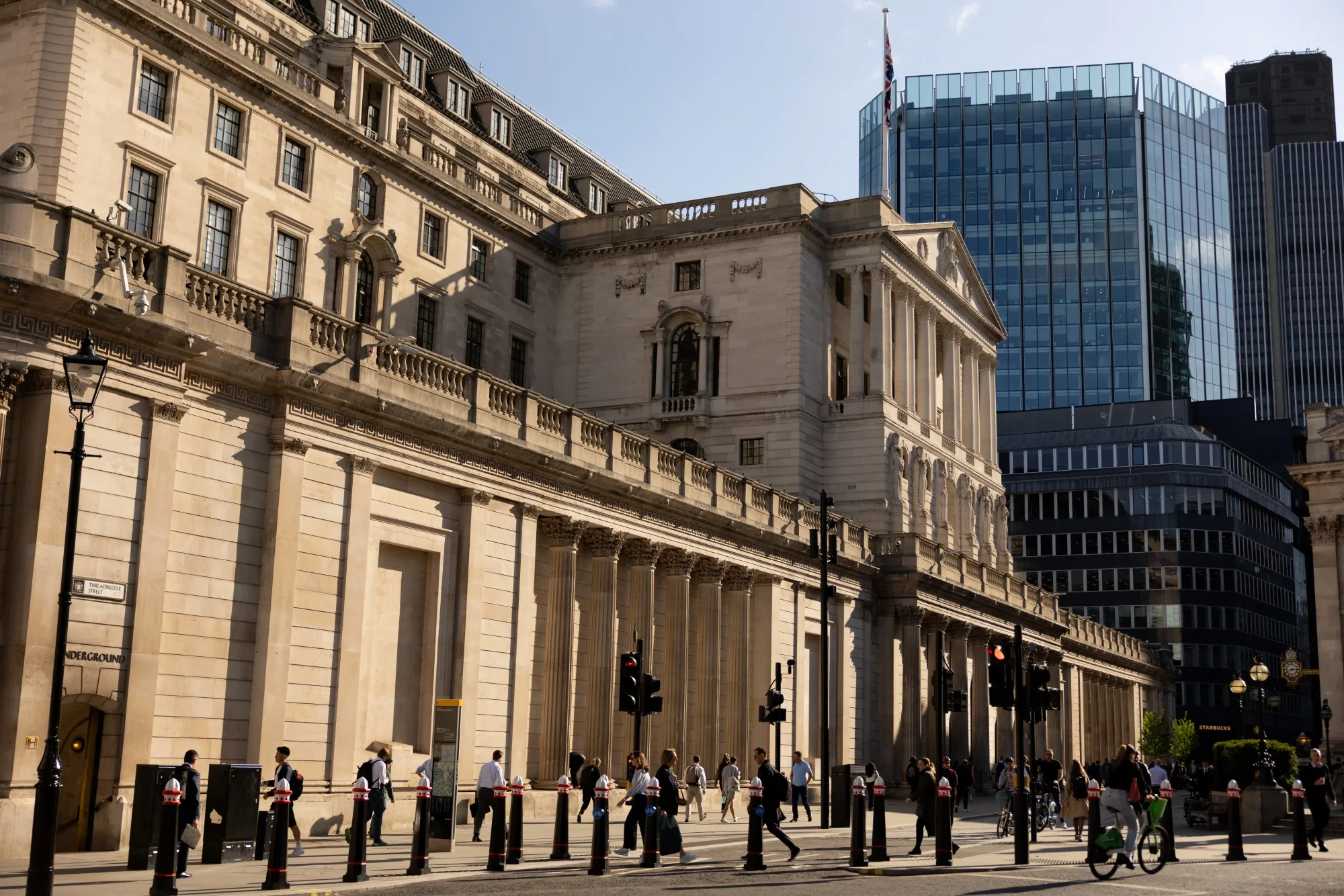Commuters pass the Bank of England&nbsp;in the City of London.