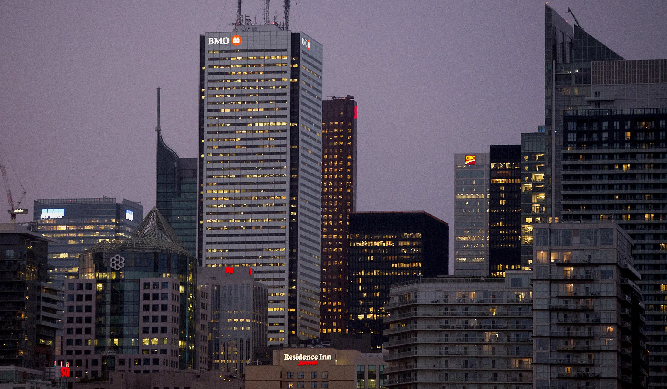 The Bank of Montreal (BMO) building, center, stands in the financial district of Toronto.
