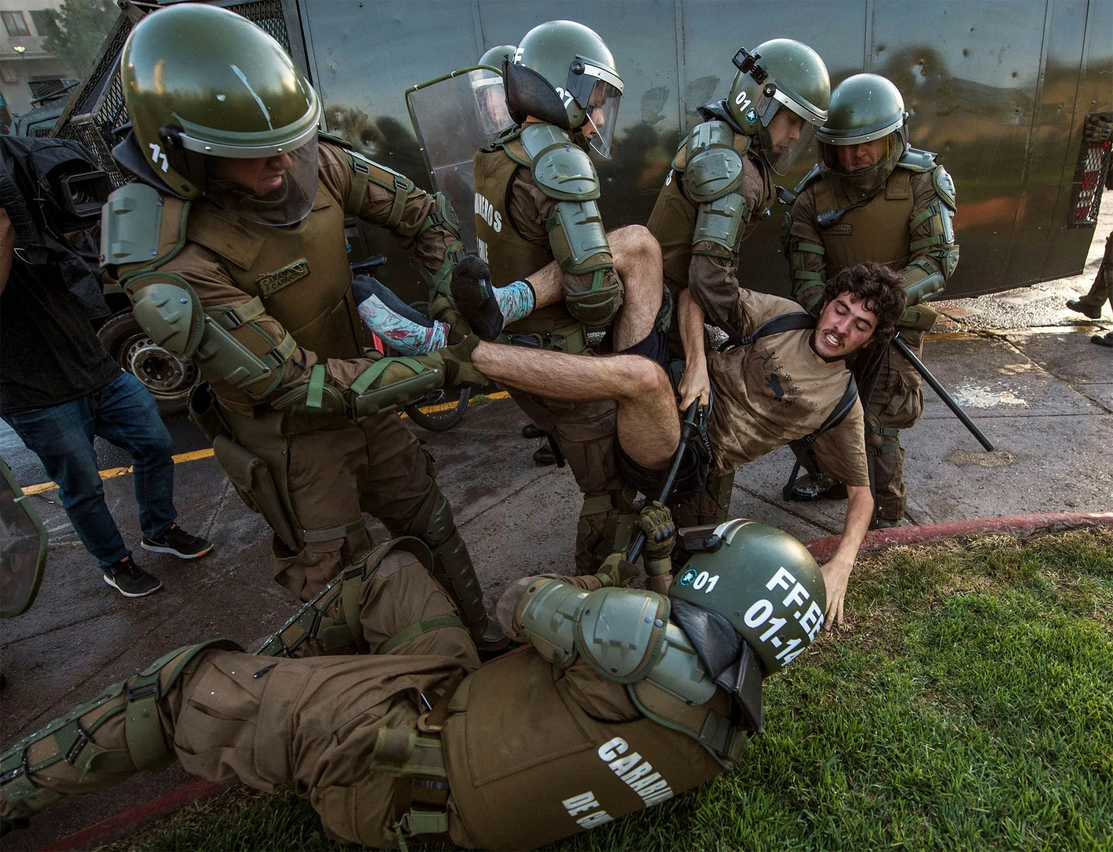 A demonstrator is arrested by riot police during a protest for the death of Mapuche Camilo Catrillanca in Santiago, on Nov. 15.&nbsp;