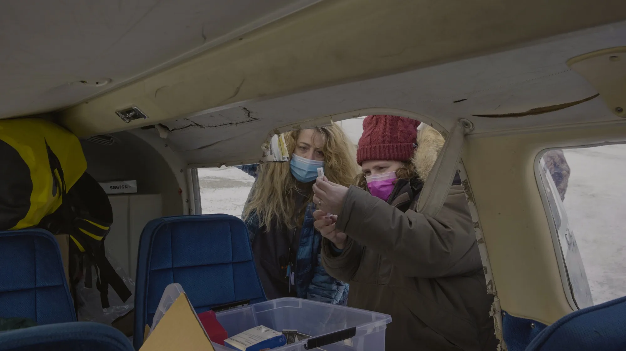 Dr. Ellen Hodges (right) and nurse&nbsp;Melissa Tefft prepare&nbsp;doses of Covid-19 vaccine delivered via bush plane.&nbsp;