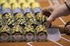 A dealer handles gaming chips on the floor of the casino at the MGM Cotai casino resort, developed by MGM China Holdings Ltd., in Macau, China, on Tuesday, Feb. 13, 2018. MGM Resorts International’s debut of its $3.4 billion property Tuesday is the latest bet on the world’s biggest casino hub, as licensing bids and China’s proposal to allow gambling on a nearby island cast uncertainties over Macau’s future.
