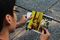Vu Tien, a university student in Ho Chi Minh City, holds photographs of his father who served in the military of the former Republic of Vietnam that governed the nation's south from 1954 to 1975.